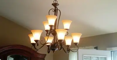Classic ceiling chandelier installation with warm lighting in Las Vegas, NV