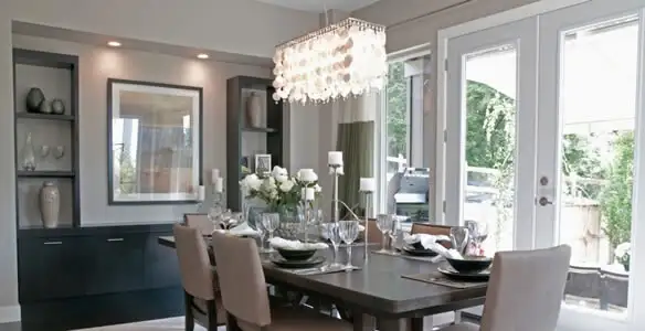 Elegant dining room chandelier installation above table in Las Vegas, NV