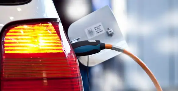 Electric car plugged into EV charger after professional installation in Las Vegas, NV
