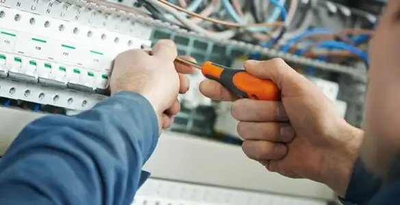 electrical service showing licensed electrician performing electrical panel maintenance and adjustments in Las Vegas, NV
