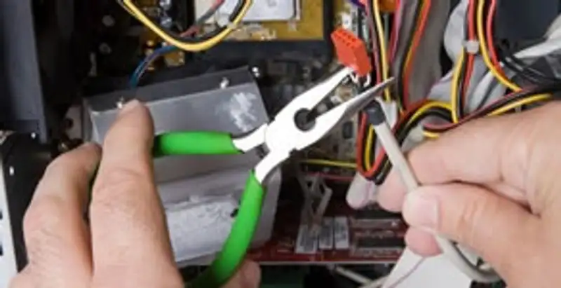Licensed electrical contractor performing electrical repair with tools in North Las Vegas, NV