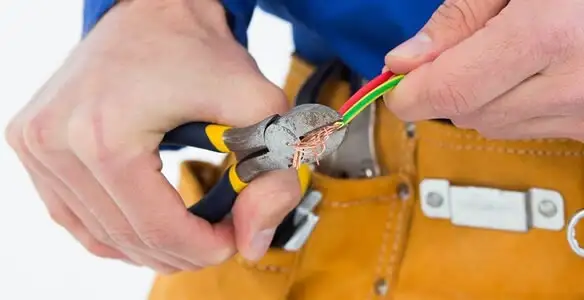 licensed electrician securing electrical wiring with professional tools during service work in Las Vegas, NV