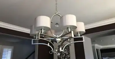 Modern chandelier installation with multiple light fixtures in Las Vegas, NV