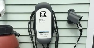 Outdoor electric vehicle charger installation on residential wall in Las Vegas, NV